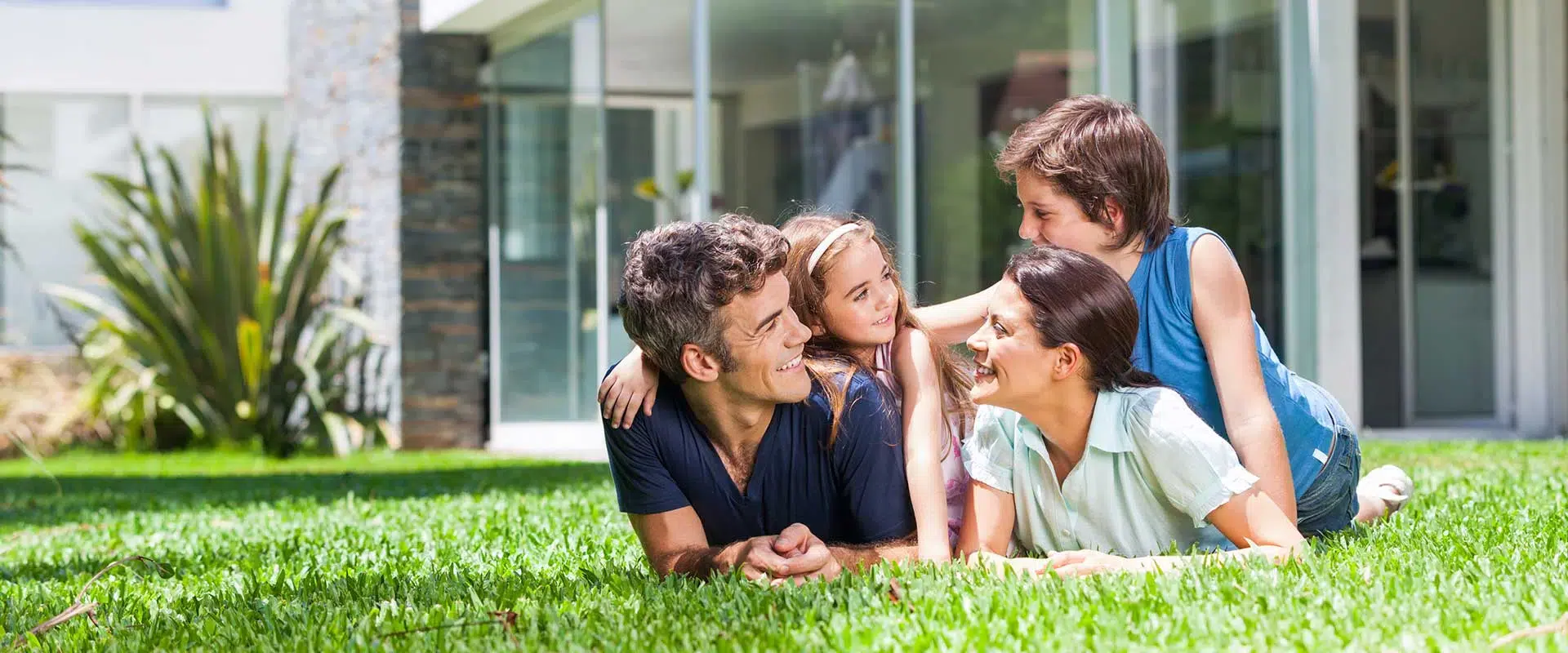 Family in their front yard after receiving roach pest control services Family in their front yard after receiving roach pest control services